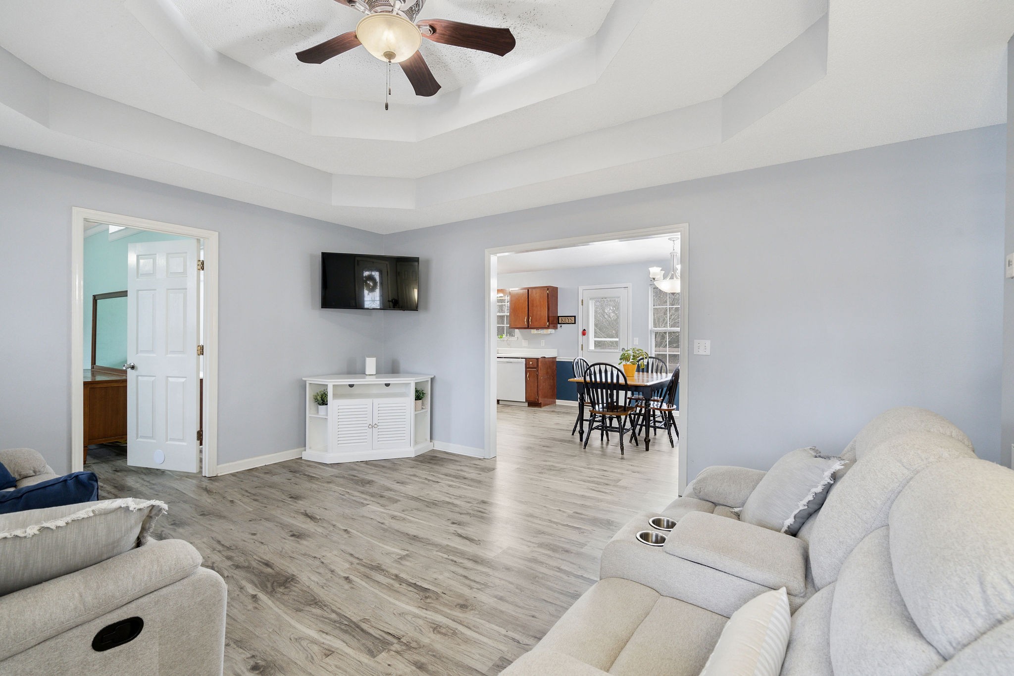 2335 Sawmill Street Murfreesboro, TN 37128 - Photo 6 of 34 a living room with furniture and a dining table with wooden floor