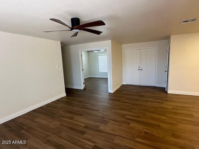 4213 East Mandan Street Phoenix, AZ 85044 - Photo 13 of 16 a view of empty room with wooden floor and ceiling fan