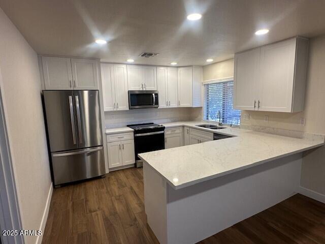 4213 East Mandan Street Phoenix, AZ 85044 - Photo 4 of 16 a kitchen with stainless steel appliances a refrigerator and a stove top oven