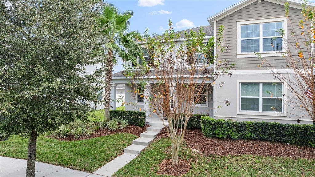 15036 Chapter Way Winter Garden, FL 34787 - Photo 1 of 1 a front view of a house with a garden and plants
