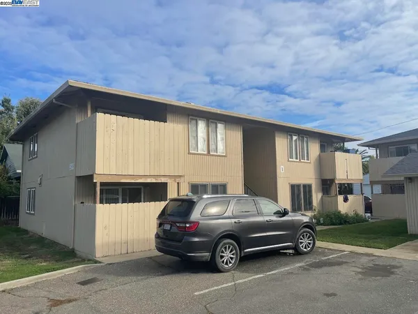a car parked in front of a house