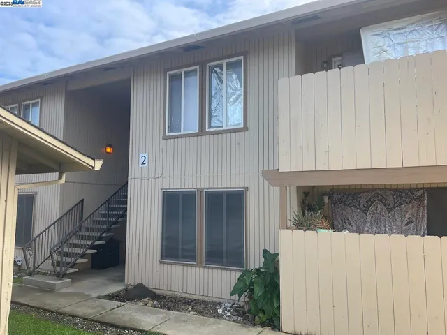 a view of a house with entryway and wooden floor