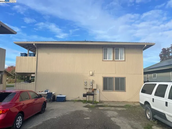 a view of a car park in front of house