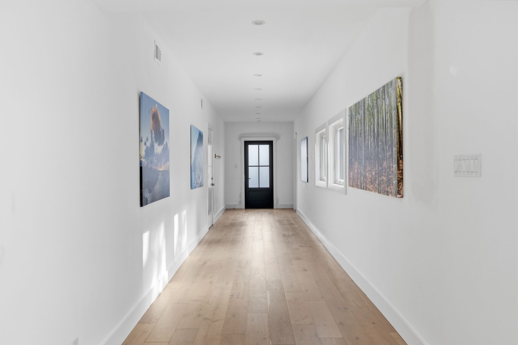 3508 Bridle Path Austin, TX 78703 - Photo 18 of 40 a view of a hallway with wooden floor and windows