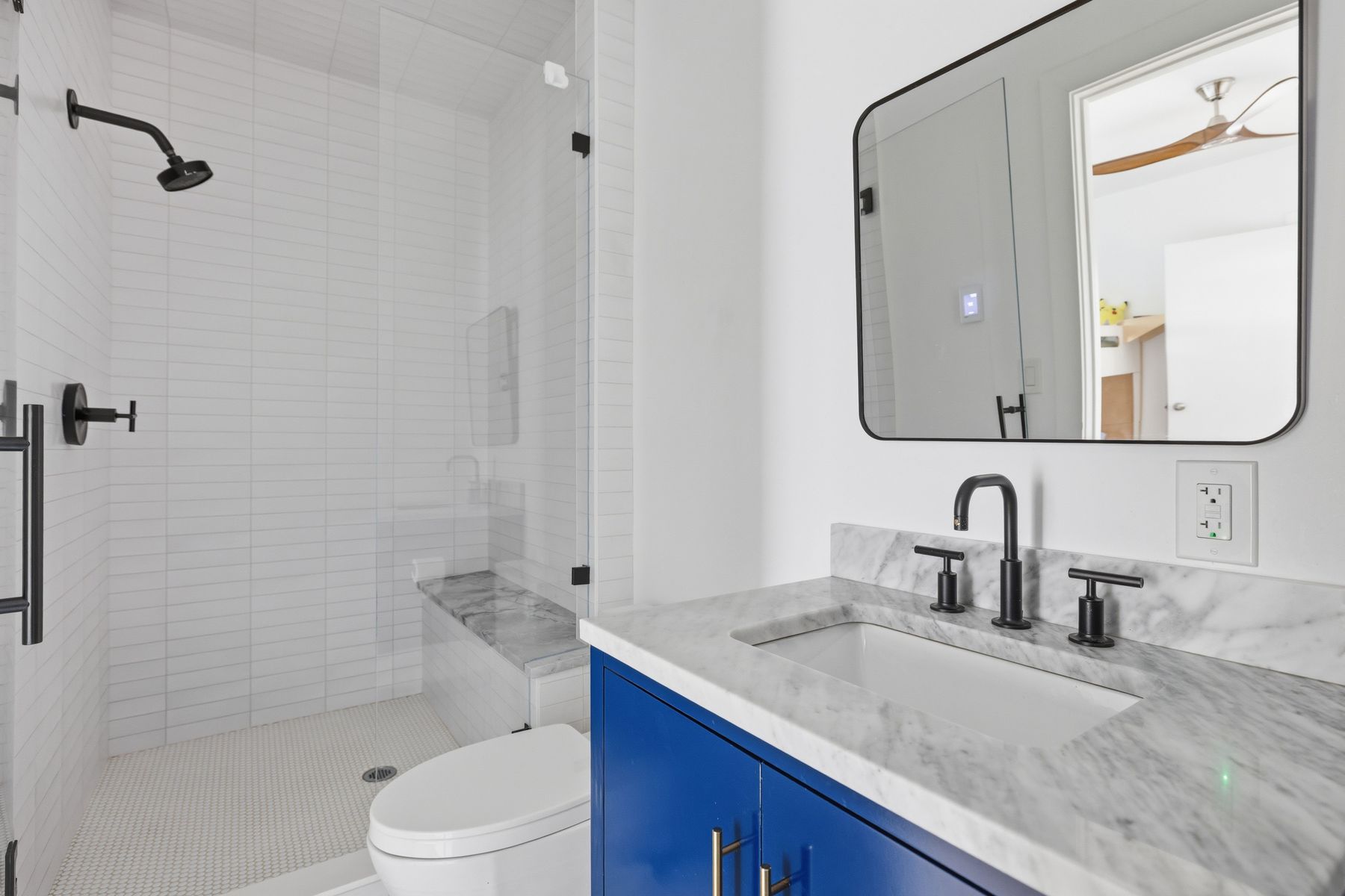 3508 Bridle Path Austin, TX 78703 - Photo 23 of 40 a bathroom with a granite countertop sink toilet and shower