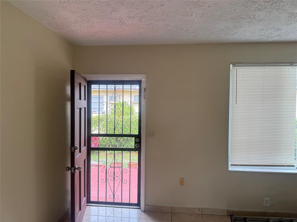 2986 Northwest 91st Street Miami, FL 33147 - Photo 15 of 40 a view of an empty room with a window