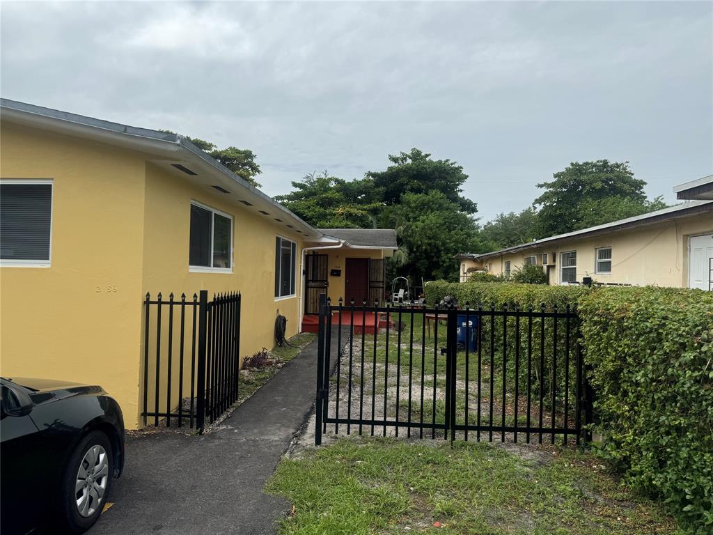 2986 Northwest 91st Street Miami, FL 33147 - Photo 2 of 40 a view of a house with a roof deck