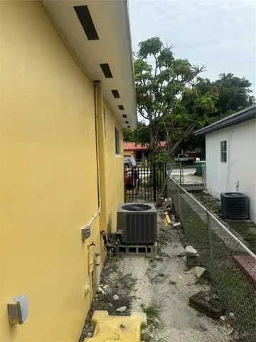 a balcony with view of an outdoor space