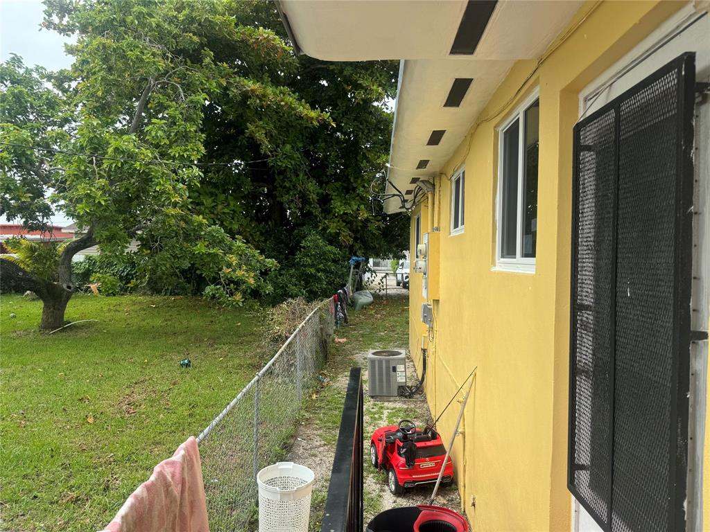 2986 Northwest 91st Street Miami, FL 33147 - Photo 25 of 40 a balcony with view of an outdoor space
