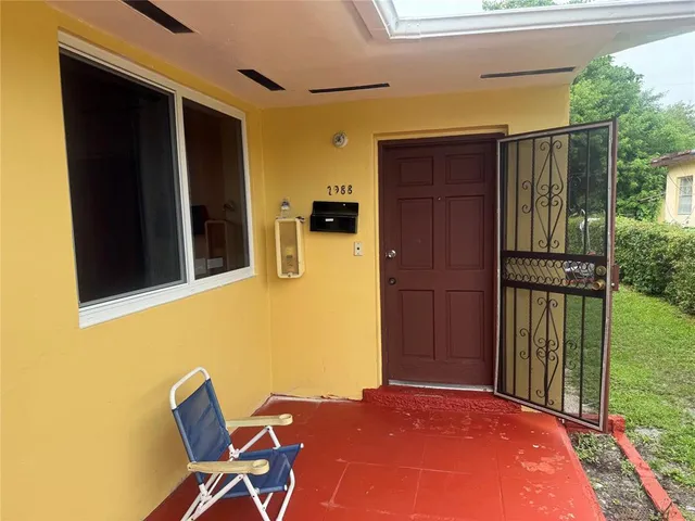 a view of a backyard with a car parked