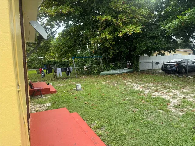 a front view of house with yard and seating area