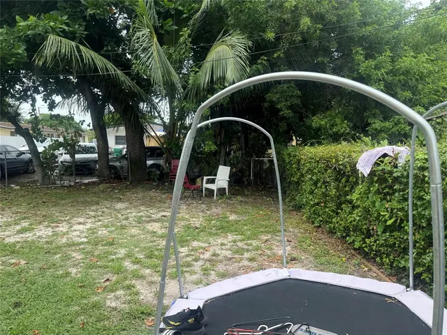 a front view of house with yard and outdoor seating