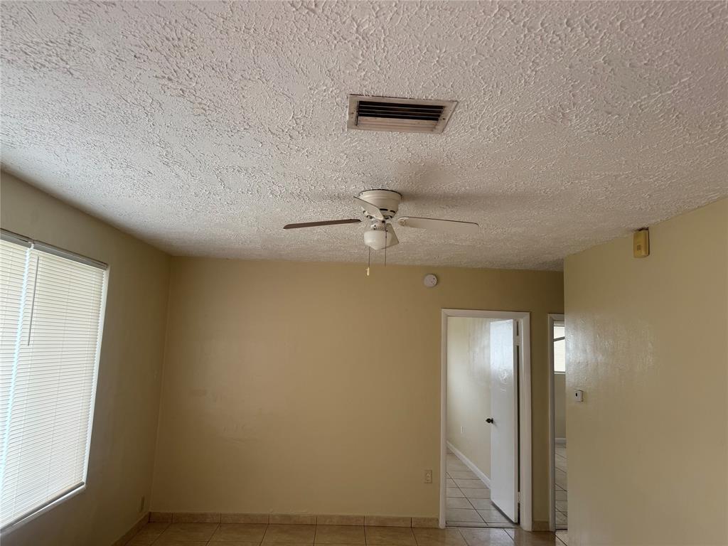 2986 Northwest 91st Street Miami, FL 33147 - Photo 3 of 40 wooden floor in a hall with a window