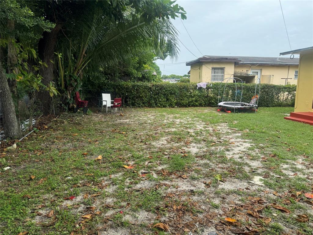 2986 Northwest 91st Street Miami, FL 33147 - Photo 35 of 40 a backyard of a house with seating space