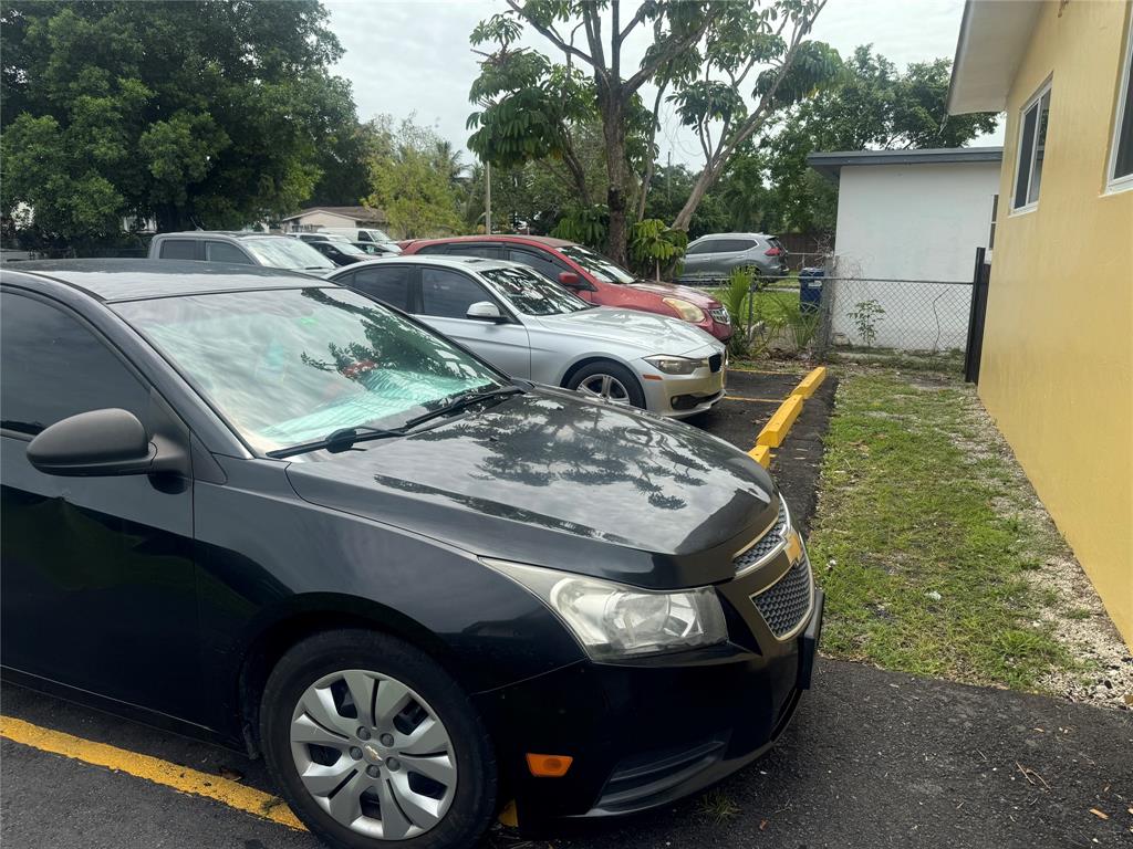 2986 Northwest 91st Street Miami, FL 33147 - Photo 37 of 40 a view of a backyard with a car parked