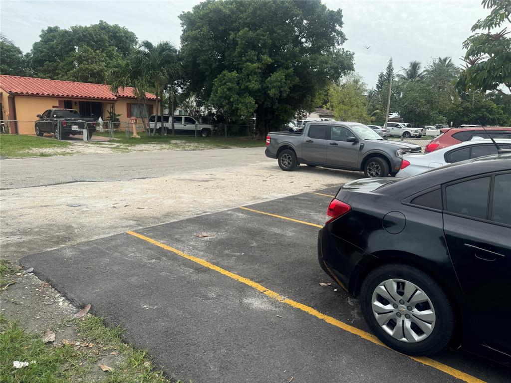 2986 Northwest 91st Street Miami, FL 33147 - Photo 38 of 40 a view of street with parked cars