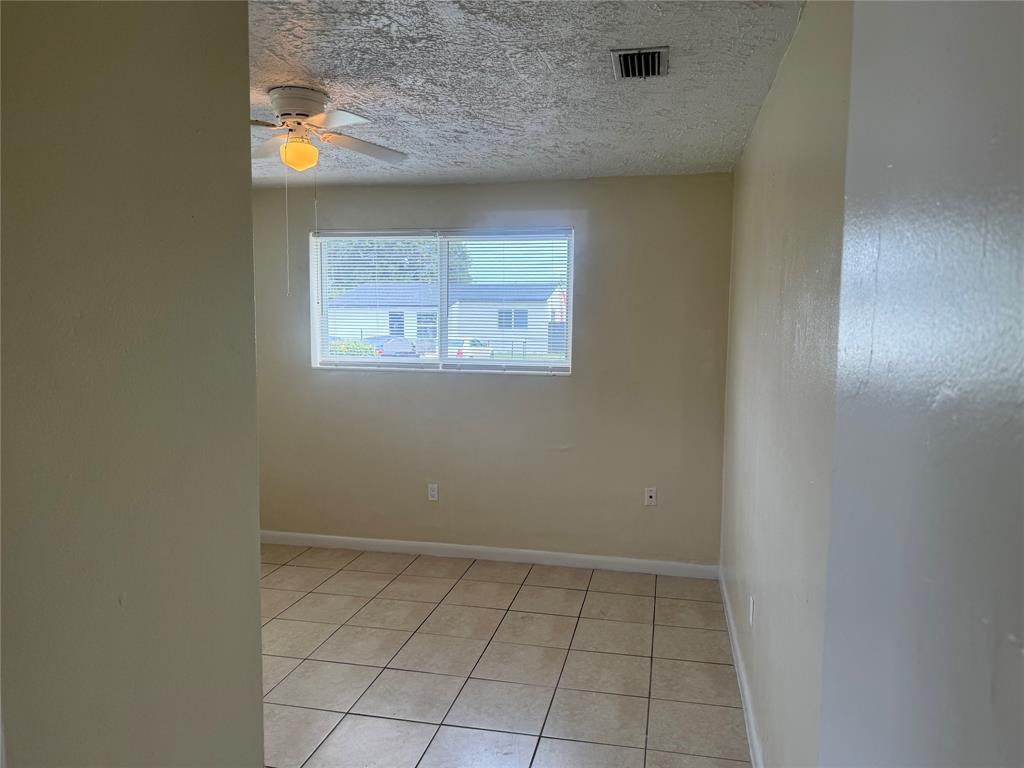2986 Northwest 91st Street Miami, FL 33147 - Photo 5 of 40 a view of an empty room and window