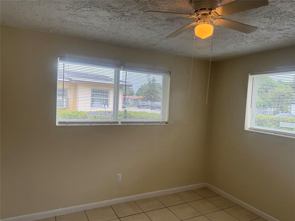 2986 Northwest 91st Street Miami, FL 33147 - Photo 6 of 40 an empty room with windows and closet