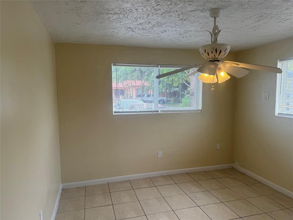2986 Northwest 91st Street Miami, FL 33147 - Photo 10 of 40 an empty room with a window