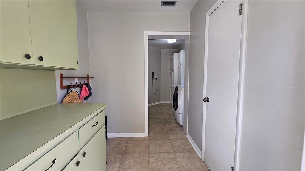 184 Lake Otis Road Winter Haven, FL 33884 - Photo 15 of 31 a utility room with cabinets