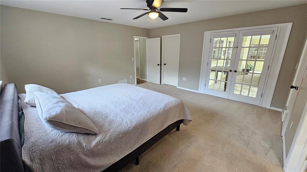 184 Lake Otis Road Winter Haven, FL 33884 - Photo 17 of 31 a spacious bedroom with a bed and window