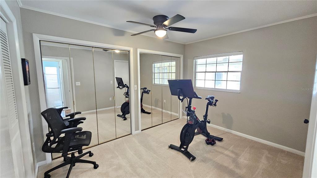 184 Lake Otis Road Winter Haven, FL 33884 - Photo 21 of 31 a view of a workspace with furniture and a window