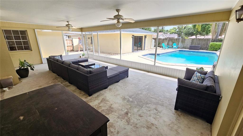 184 Lake Otis Road Winter Haven, FL 33884 - Photo 24 of 31 a living room with furniture and a large window