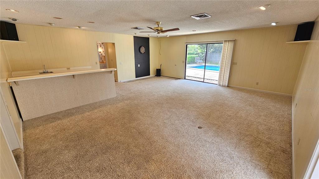 184 Lake Otis Road Winter Haven, FL 33884 - Photo 28 of 31 a view of a kitchen with a sink and a large window