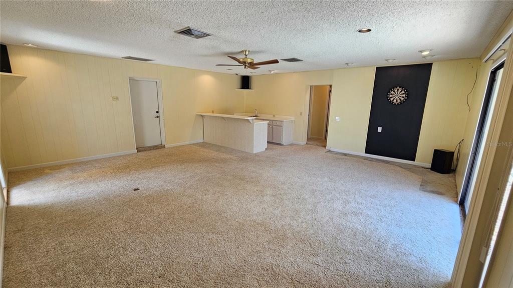 184 Lake Otis Road Winter Haven, FL 33884 - Photo 29 of 31 a view of a livingroom with a ceiling fan