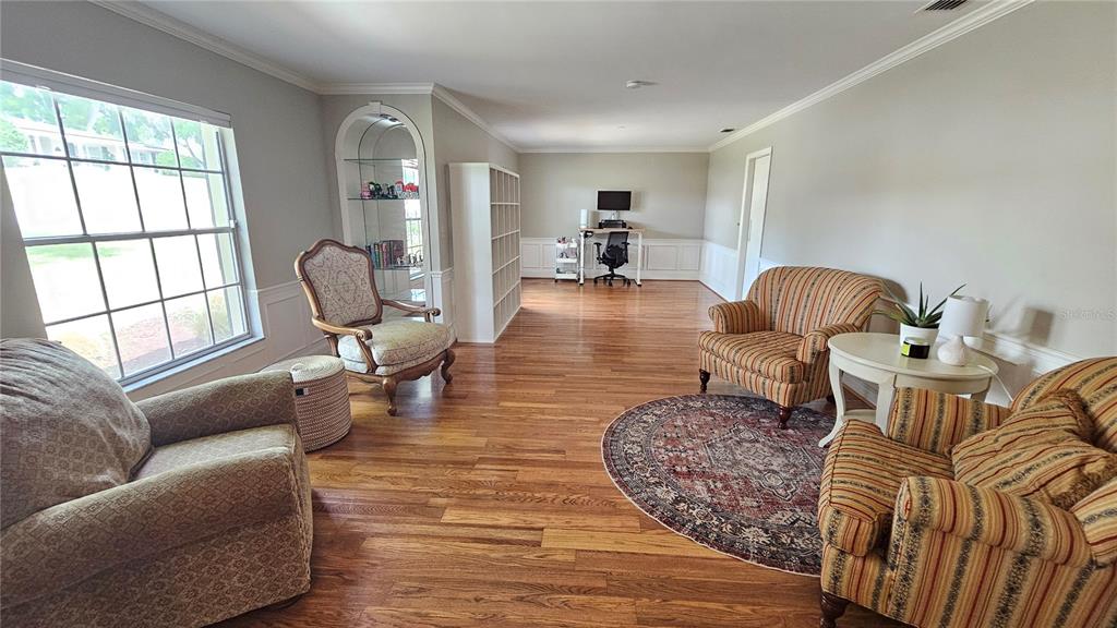 184 Lake Otis Road Winter Haven, FL 33884 - Photo 5 of 31 a living room with furniture and a wooden floor