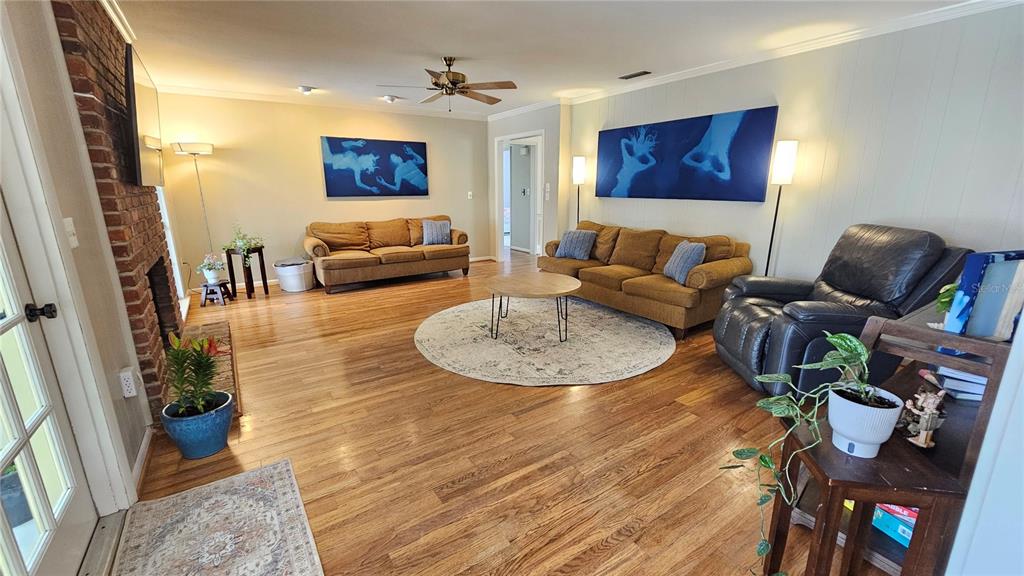184 Lake Otis Road Winter Haven, FL 33884 - Photo 9 of 31 a living room with furniture and wooden floor