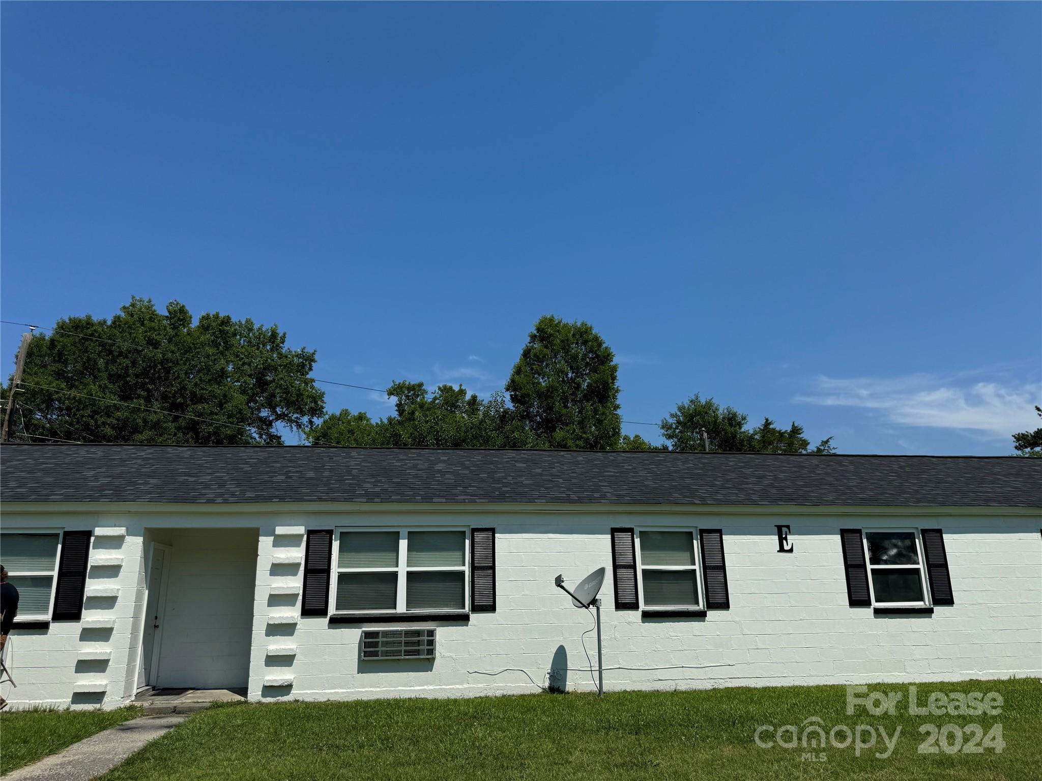 a view of house with yard