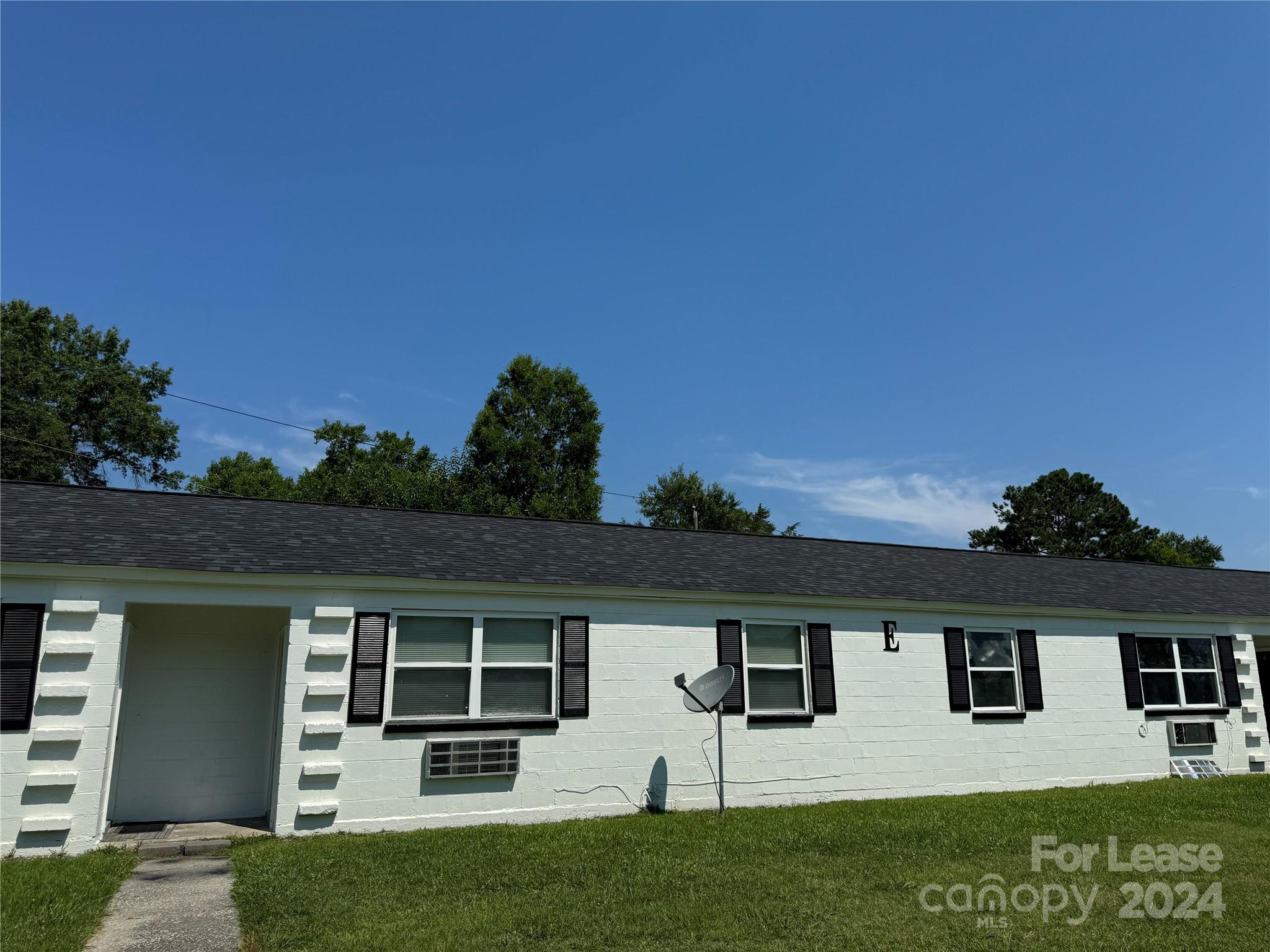 200 York Street, Unit E2 Chester, SC 29706 - Photo 2 of 15 a view of a yard in front of a house with large windows
