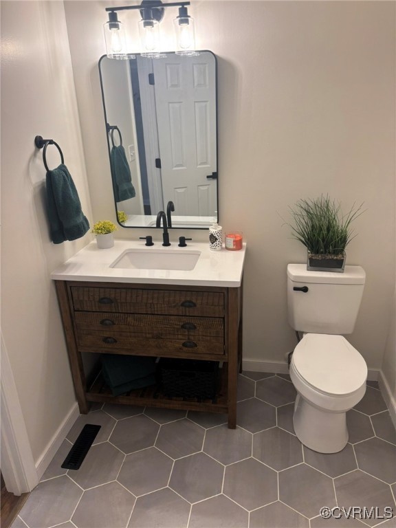 252 Mill Road King William, VA 23086 - Photo 17 of 28 Bathroom featuring vanity, toilet, and tile patter