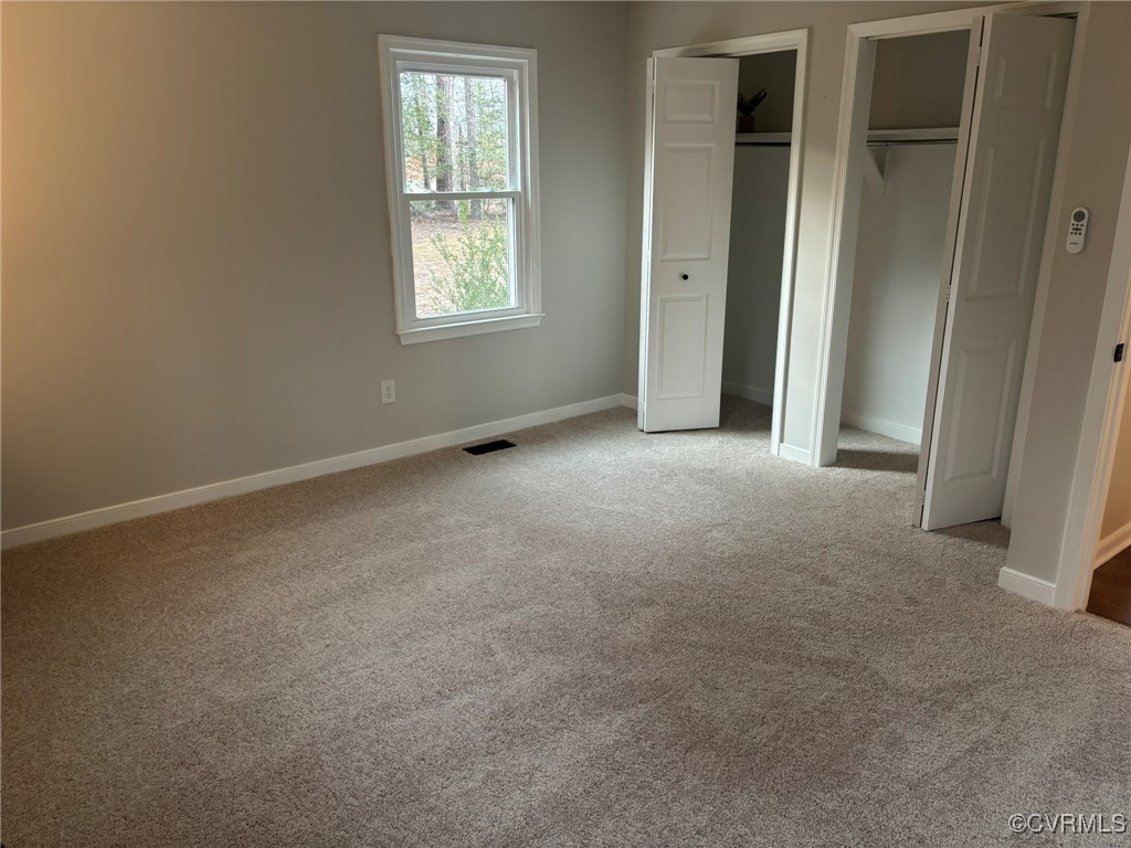 252 Mill Road King William, VA 23086 - Photo 20 of 28 Unfurnished bedroom featuring light carpet and two