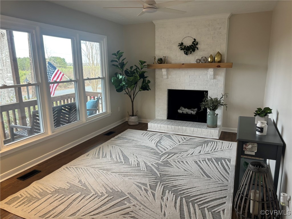 Living room with hardwood / wood-style flooring, a