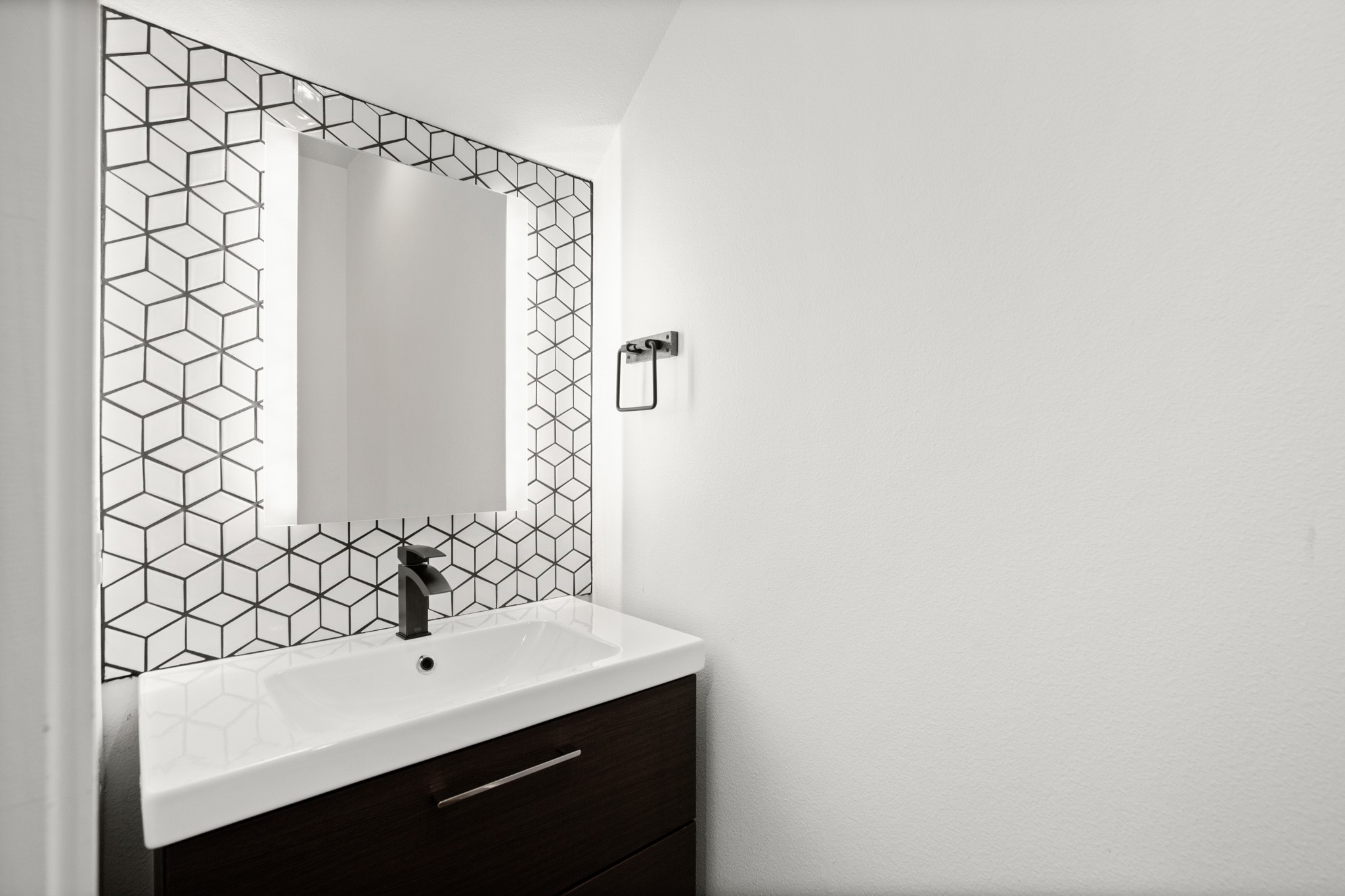 4608 Santa Anna Street, Unit 1 Austin, TX 78721 - Photo 14 of 35 Half bathroom downstairs with refreshed geometric tiling.