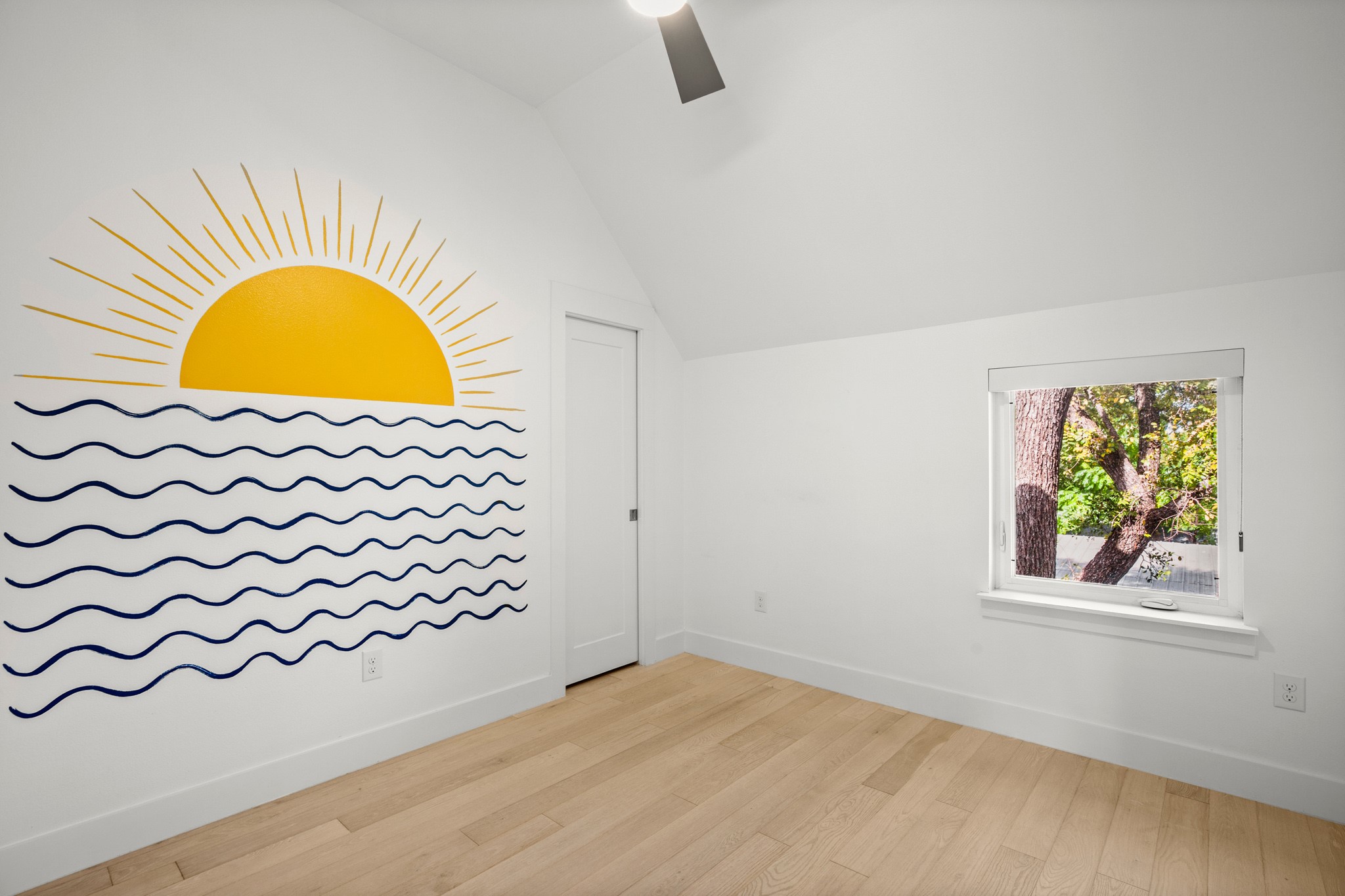 4608 Santa Anna Street, Unit 1 Austin, TX 78721 - Photo 22 of 35 First bedroom that was previously used as a meditation room and a nursery. Closet has built-in shelving and storage, too.