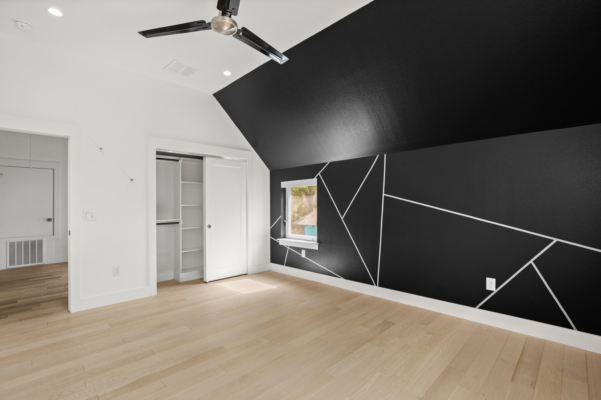 4608 Santa Anna Street, Unit 1 Austin, TX 78721 - Photo 27 of 35 Primary suite with one of the closets with built-in shelving and storage. The other large closet is in the bathroom.