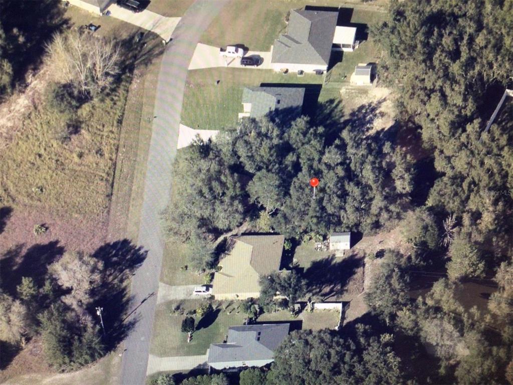 0 Southwest 48th Avenue Road Ocala, FL 34473 - Photo 1 of 1 an aerial view of a house with a yard and large tree