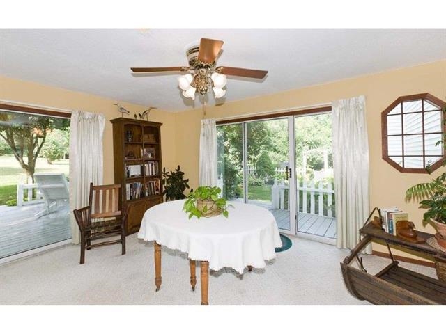 8405 Snaresbrook Road Roscoe, IL 61073 - Photo 8 of 20 a living room with furniture and a large window