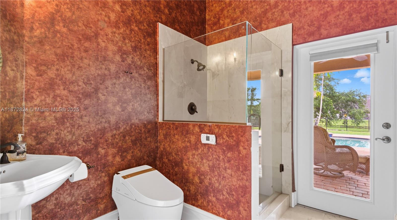 13040 Southwest 30th Court Davie, FL 33330 - Photo 12 of 42 a bathroom with a toilet a sink and mirror