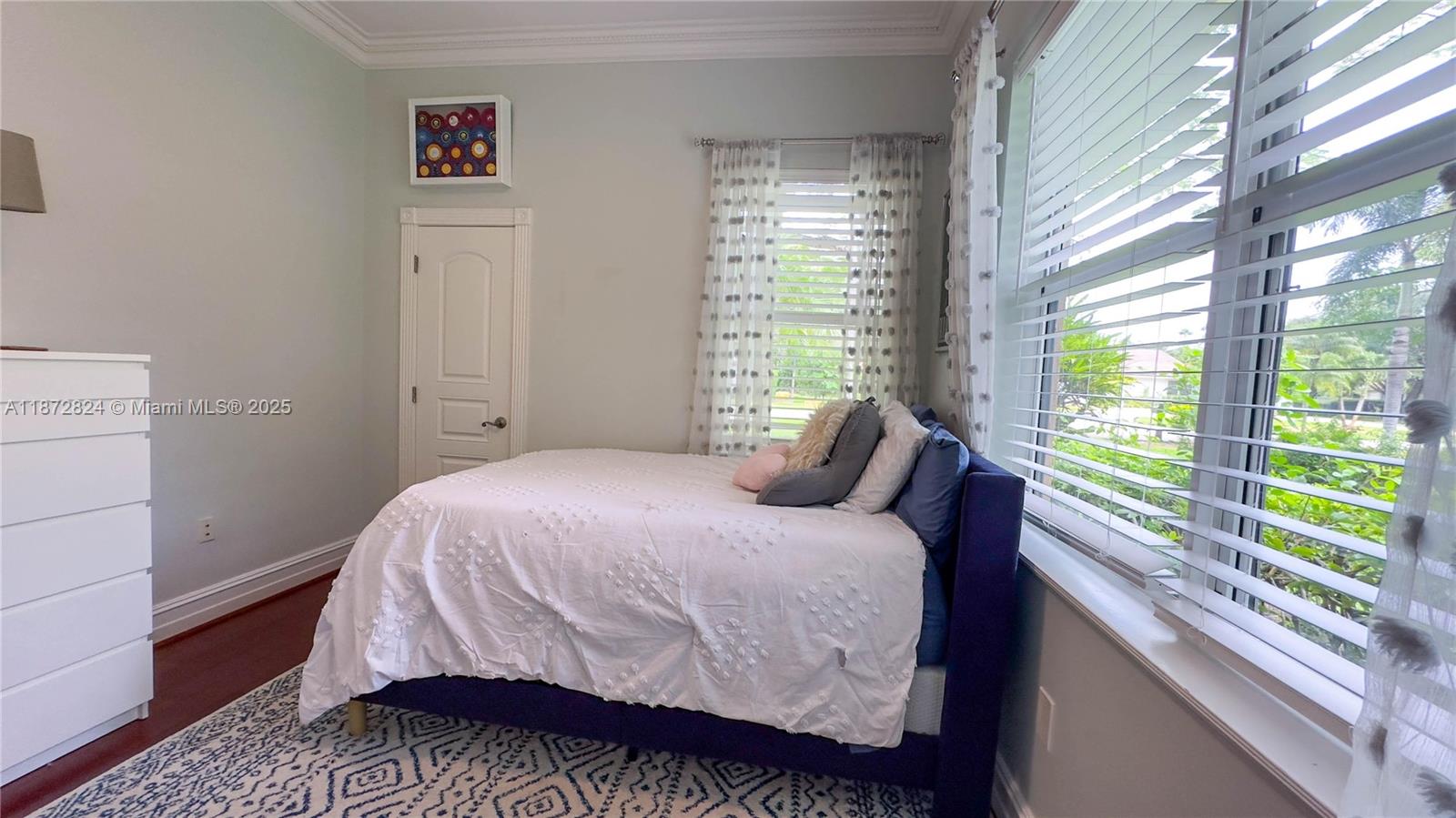 13040 Southwest 30th Court Davie, FL 33330 - Photo 15 of 42 a bedroom with a bed and a window