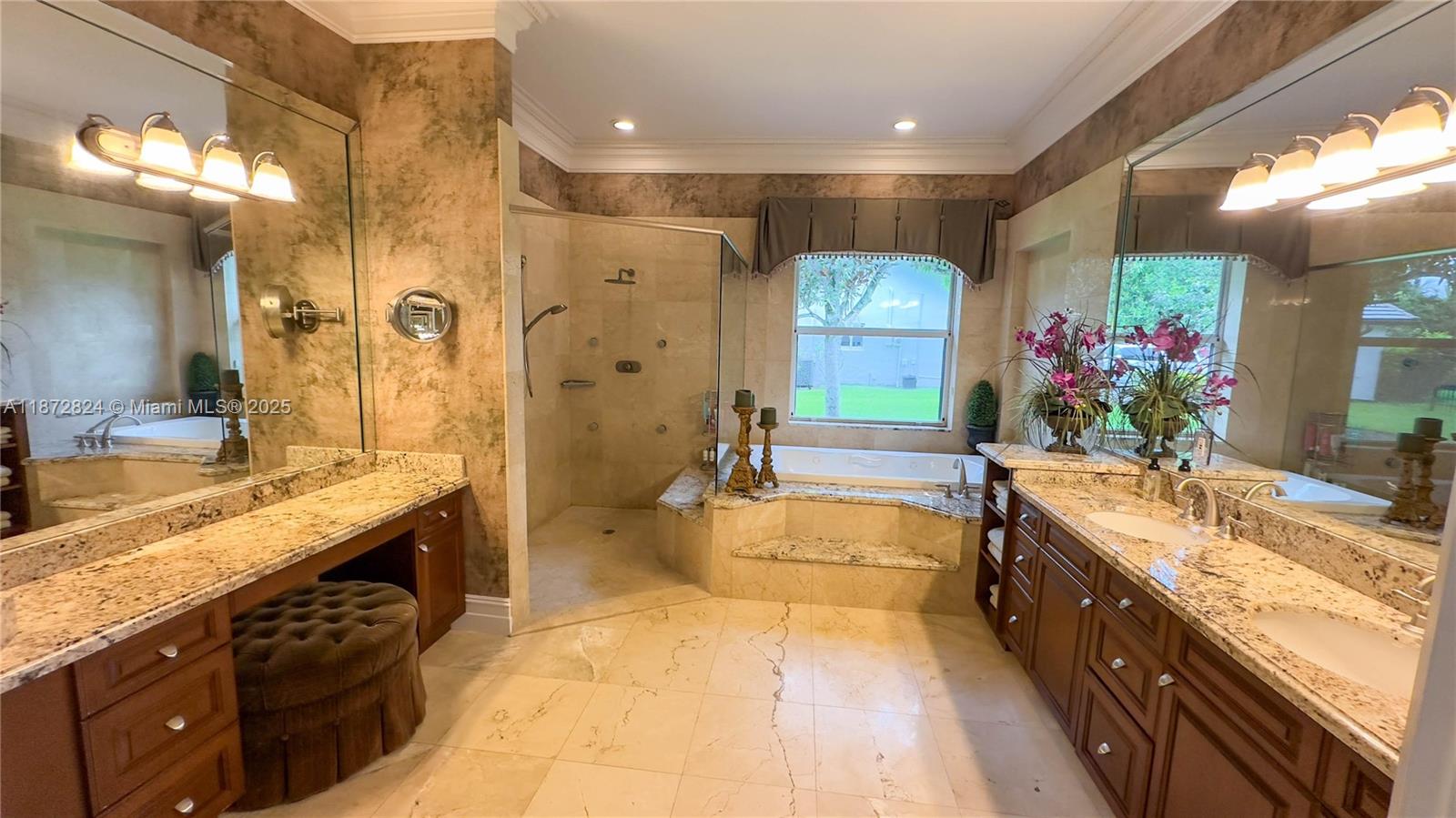 13040 Southwest 30th Court Davie, FL 33330 - Photo 18 of 42 a large bathroom with a granite countertop double vanity sink a large mirror and a bathtub