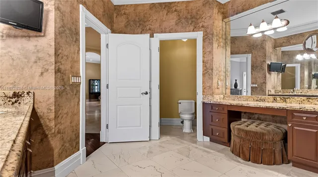 a spacious bathroom with a granite countertop sink a mirror and a shower