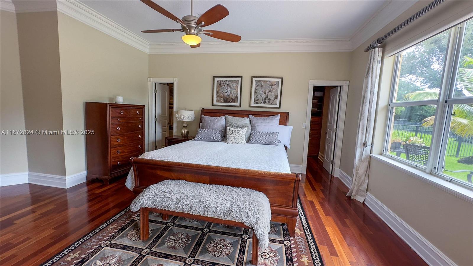 13040 Southwest 30th Court Davie, FL 33330 - Photo 21 of 42 a bedroom with a bed and wooden floor