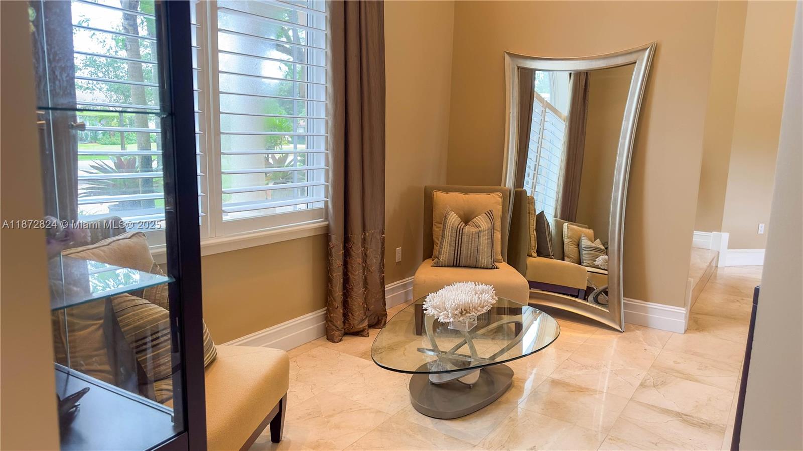 13040 Southwest 30th Court Davie, FL 33330 - Photo 24 of 42 a living room with furniture and a large window