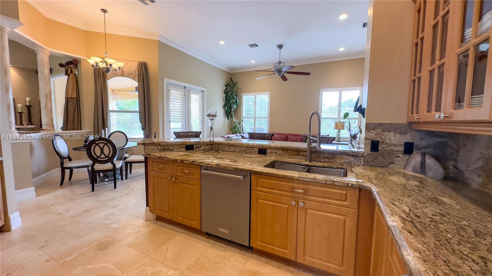 13040 Southwest 30th Court Davie, FL 33330 - Photo 25 of 42 a large kitchen with kitchen island a sink and a large window