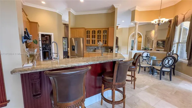 a dining table with chairs and wooden floor
