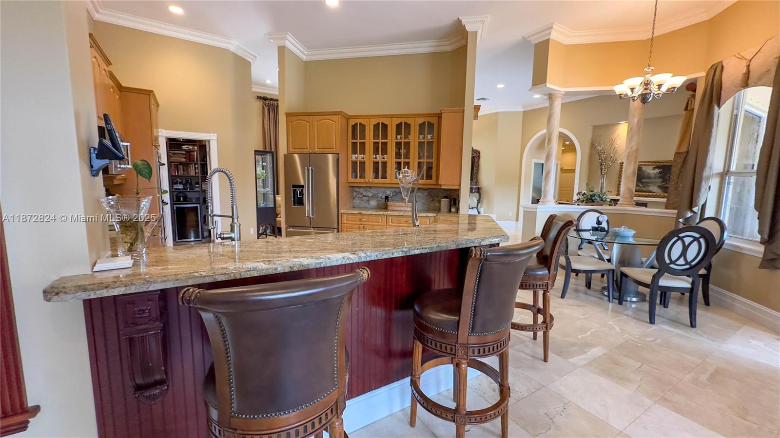 13040 Southwest 30th Court Davie, FL 33330 - Photo 28 of 42 a dining table with chairs and wooden floor